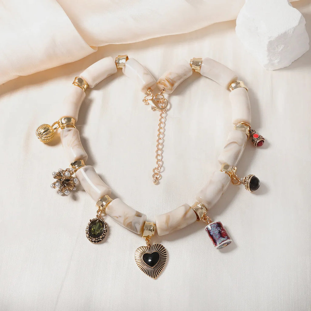 Green bamboo leaf heart-shaped resin pendant necklace with gold tone electroplated chain