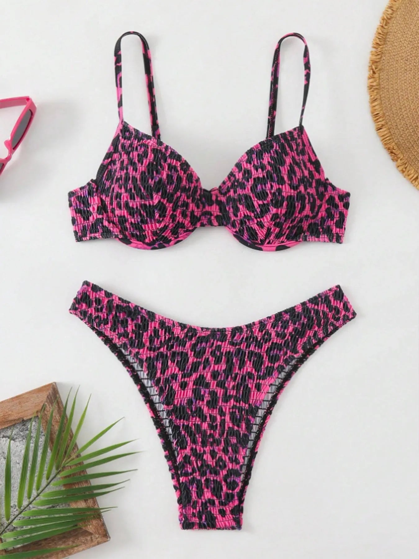Women's leopard point bikini swimsuit in a backless brief style, shown in brown mixed colour.
