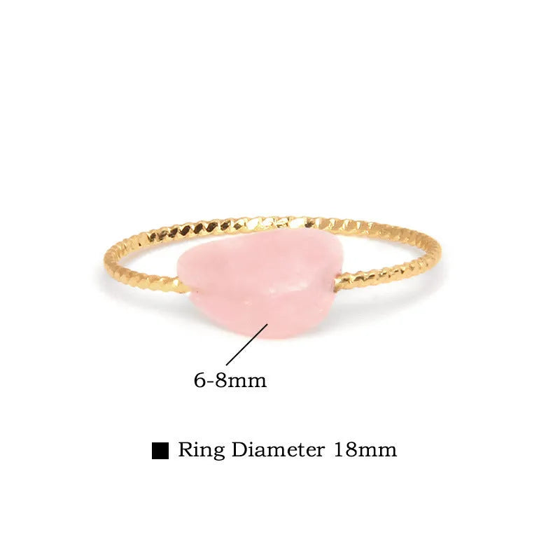 Geometric silver-tone ring with a coloured agate stone in a niche design, side view.