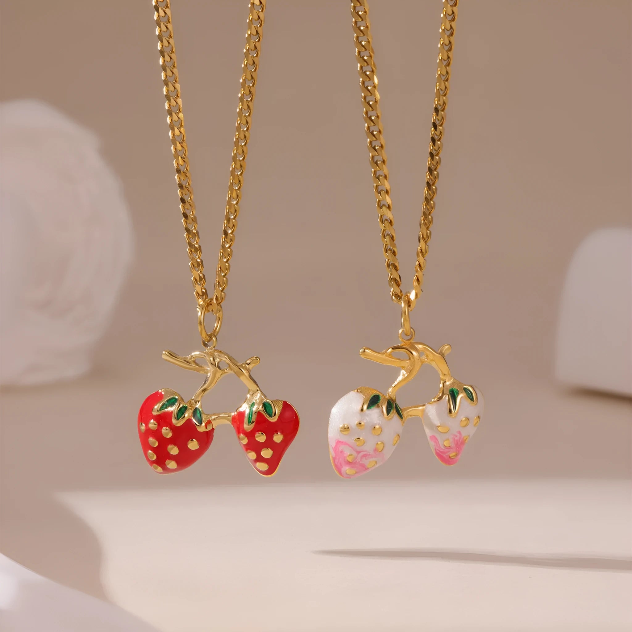 Stainless steel strawberry pendant necklace on an alloy chain, shown in red and white gradient colour options.