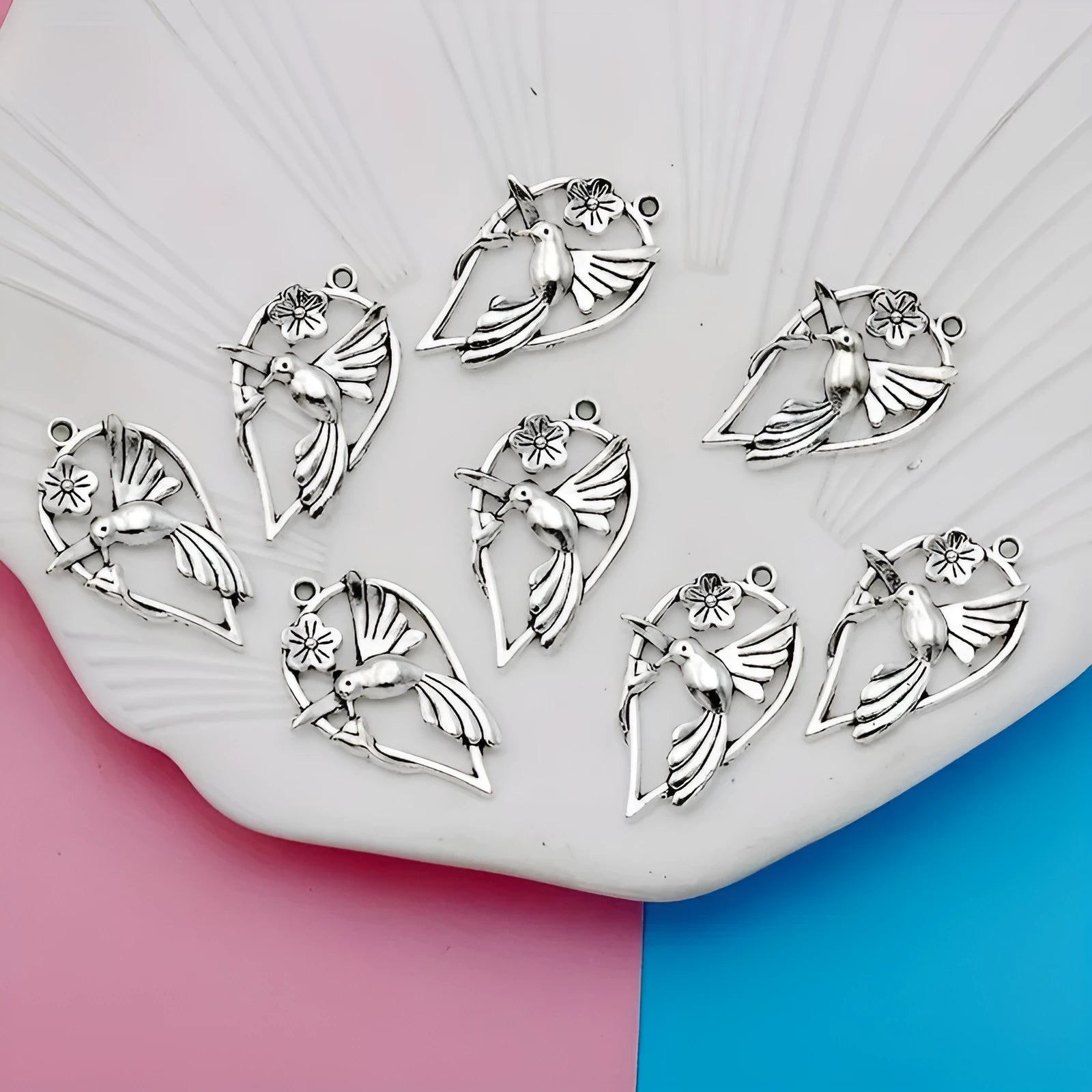 Close-up of a detailed alloy cuckoo bird charm pendant with electroplated finish in colour P234.