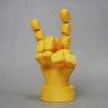 Yellow American-style hand prop figurine with movable joints on a white background