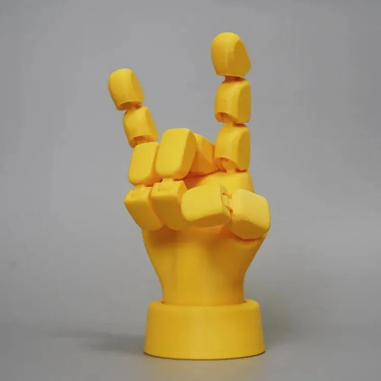 Yellow American-style hand prop figurine with movable joints on a white background