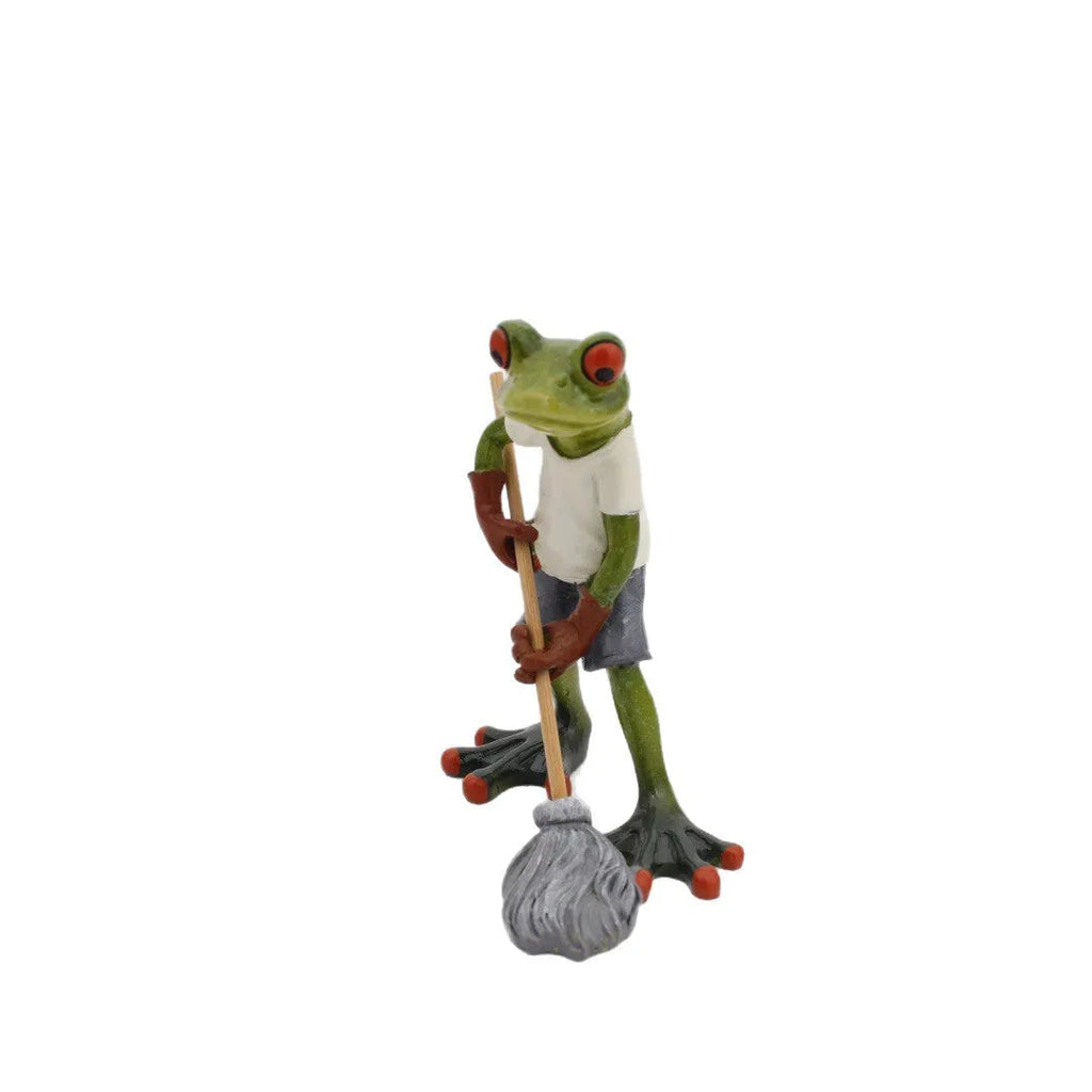 Pastoral style green resin frog decoration figurine on a wooden shelf.
