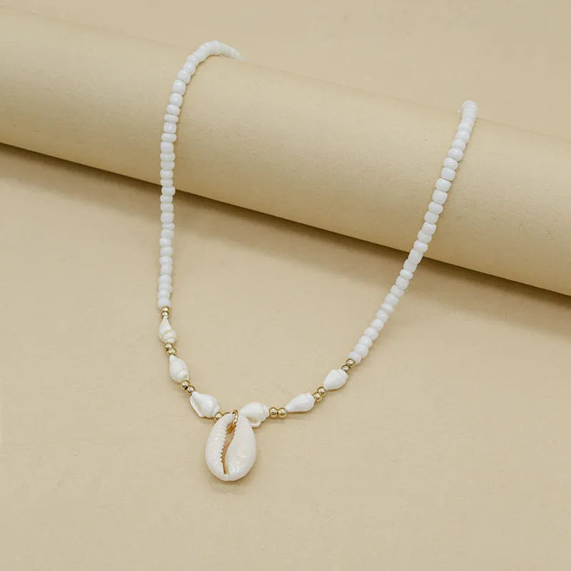 Conch white bead shell necklace with mother-of-pearl pendant on regular chain