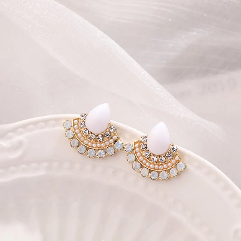 Women's silver retro fan-shaped earrings with an opal-like stone and rhinestone detailing on a geometric alloy setting.