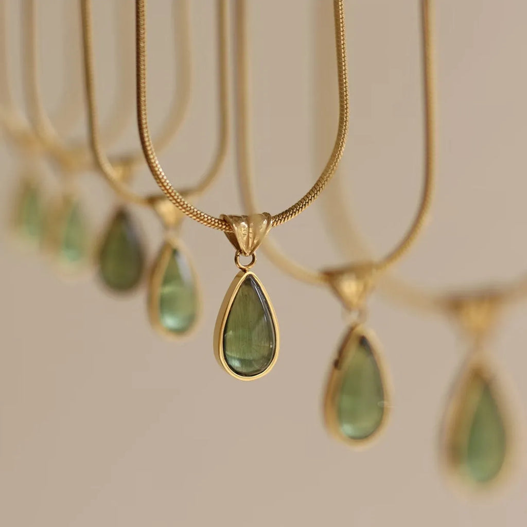 Retro water drop necklace for women with blue gemstone pendant on titanium steel snake bone chain.