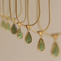 Retro water drop necklace for women with blue gemstone pendant on titanium steel snake bone chain.