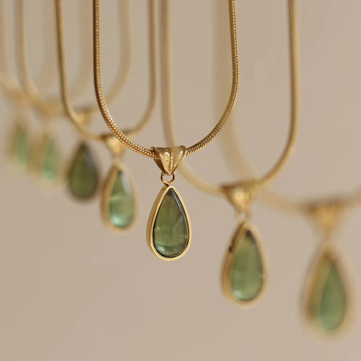 Retro water drop necklace for women with blue gemstone pendant on titanium steel snake bone chain.