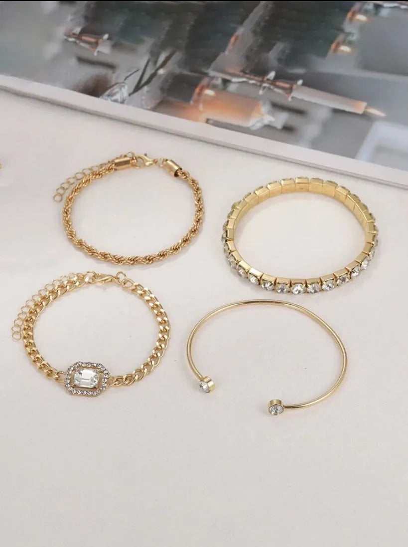 Retro geometric alloy four-piece jewellery set showing bracelet, earrings, necklace and ring with square diamond chain designs