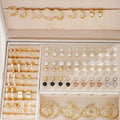 108 geometric alloy pearl earrings with round elements in gold and yellow electroplated finishes