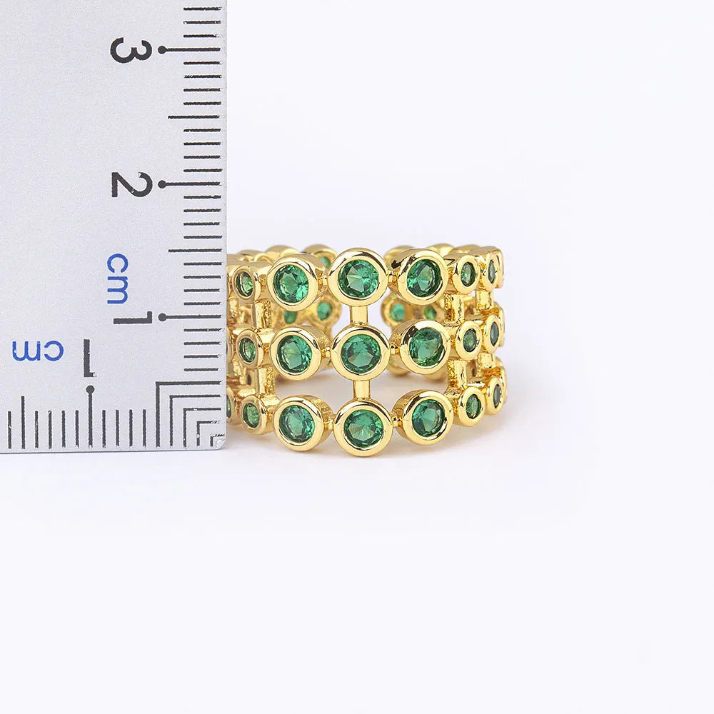 Wide band gold ring with three-layer green zircon stone setting on copper base