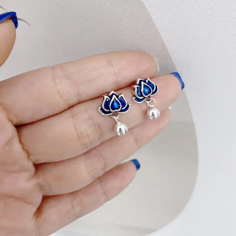 Blue lotus seedpod tassel ear studs with floral design on silver needle fittings
