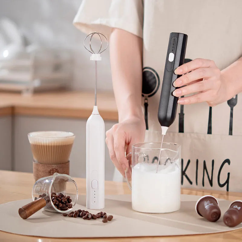 USB rechargeable handheld electric whisk in white with three speed settings and egg beater attachment
