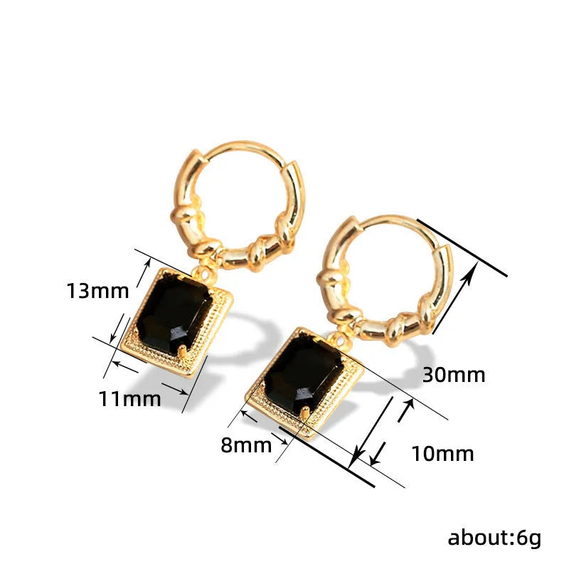 A pair of geometric black quadrilateral copper earrings with a zircon stone in a retro French court style.