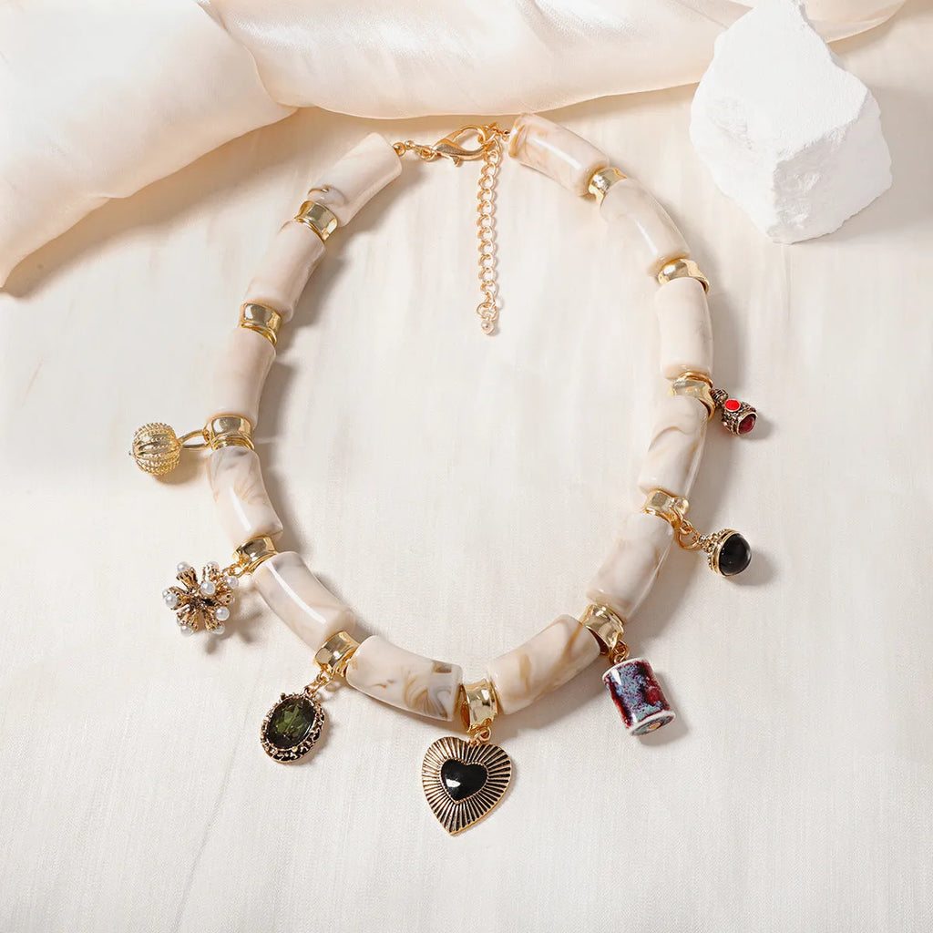 Green bamboo leaf heart-shaped resin pendant necklace with gold tone electroplated chain