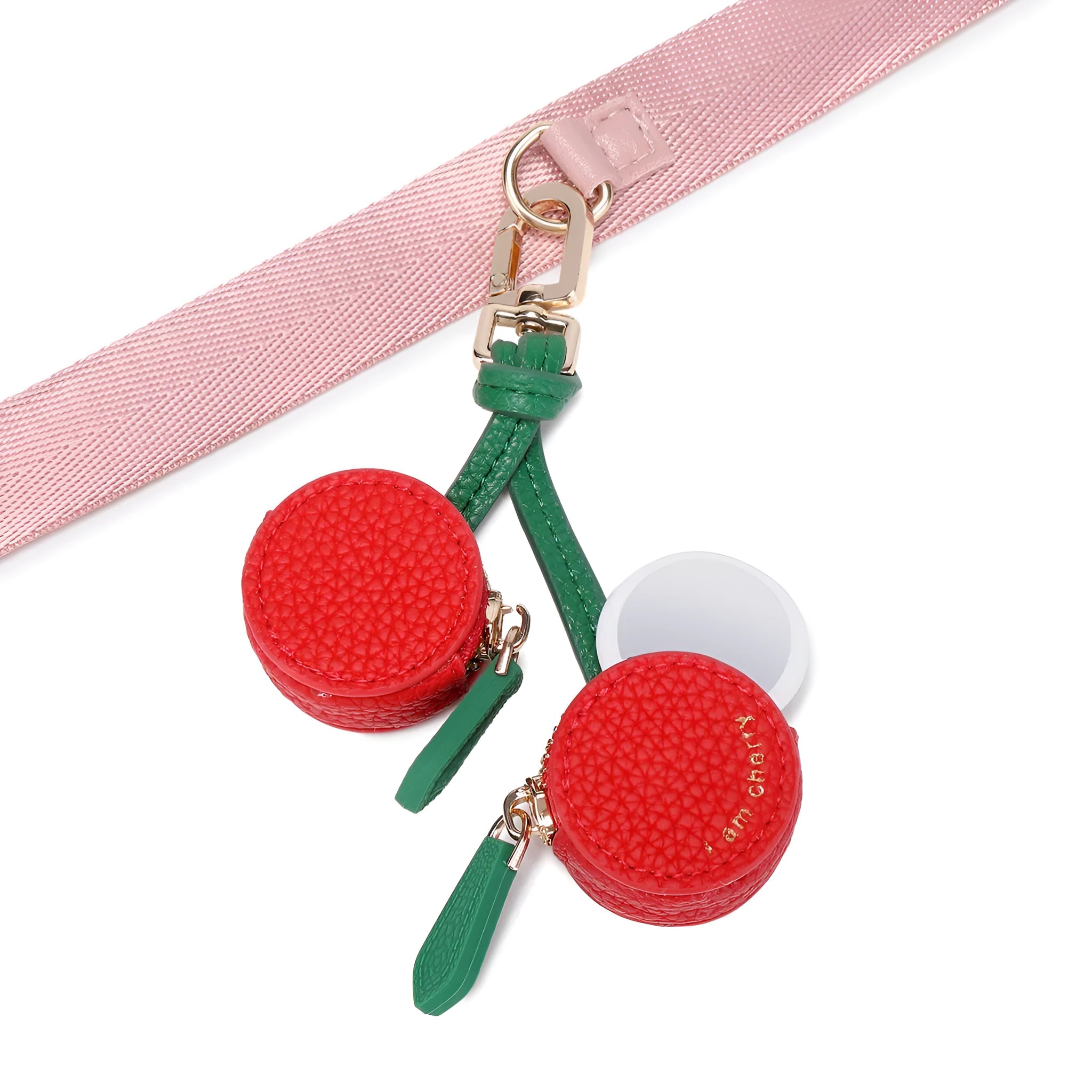 Solid colour leather keychain with small attached coin pouch in cherry red, blueberry blue, or orange.