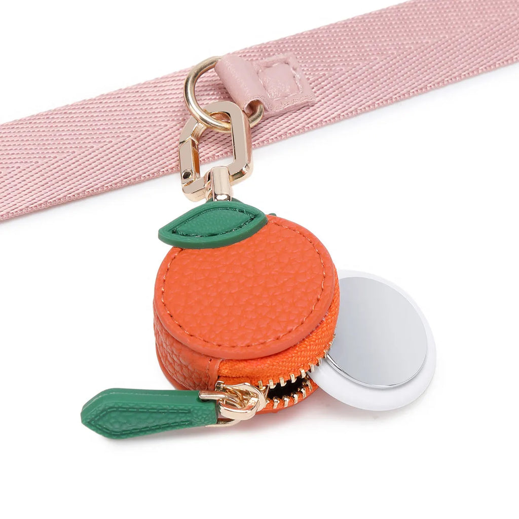 Solid colour leather keychain with small attached coin pouch in cherry red, blueberry blue, or orange.