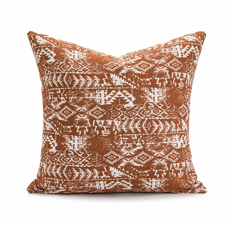 Red coffee brown square cushion with PP cotton filler on a grey sofa.