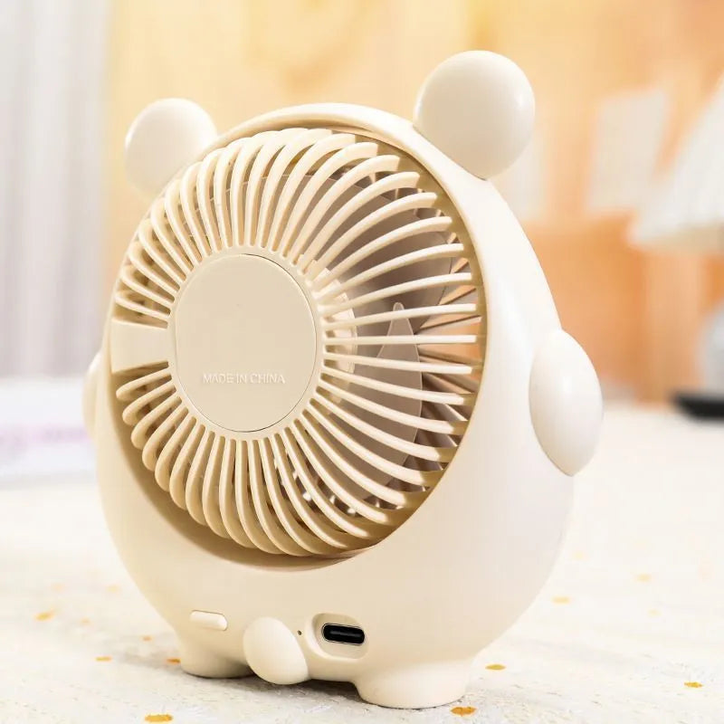 Cute dog-themed USB desktop electric fan showing three-speed controls and plastic construction