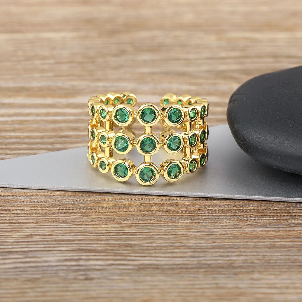 Wide band gold ring with three-layer green zircon stone setting on copper base