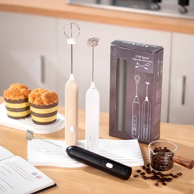 USB rechargeable handheld electric whisk in white with three speed settings and egg beater attachment