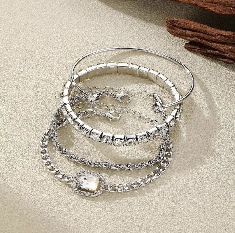 Retro geometric alloy four-piece jewellery set showing bracelet, earrings, necklace and ring with square diamond chain designs