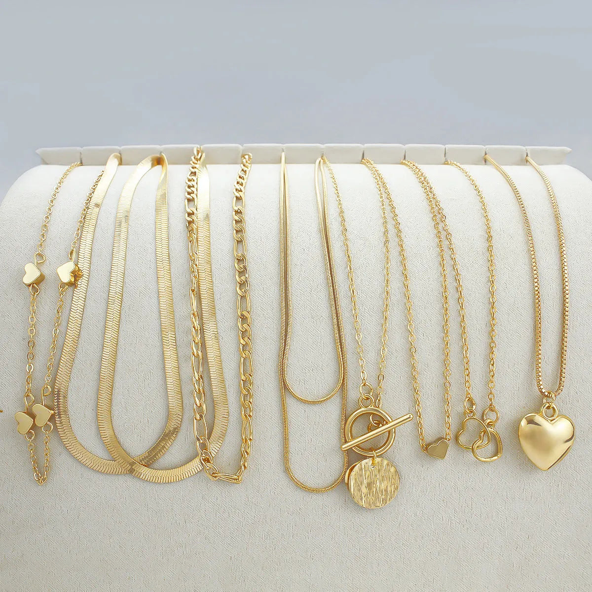 Gold electroplated women's necklace set with 10 pieces and adjustable snake bones chain
