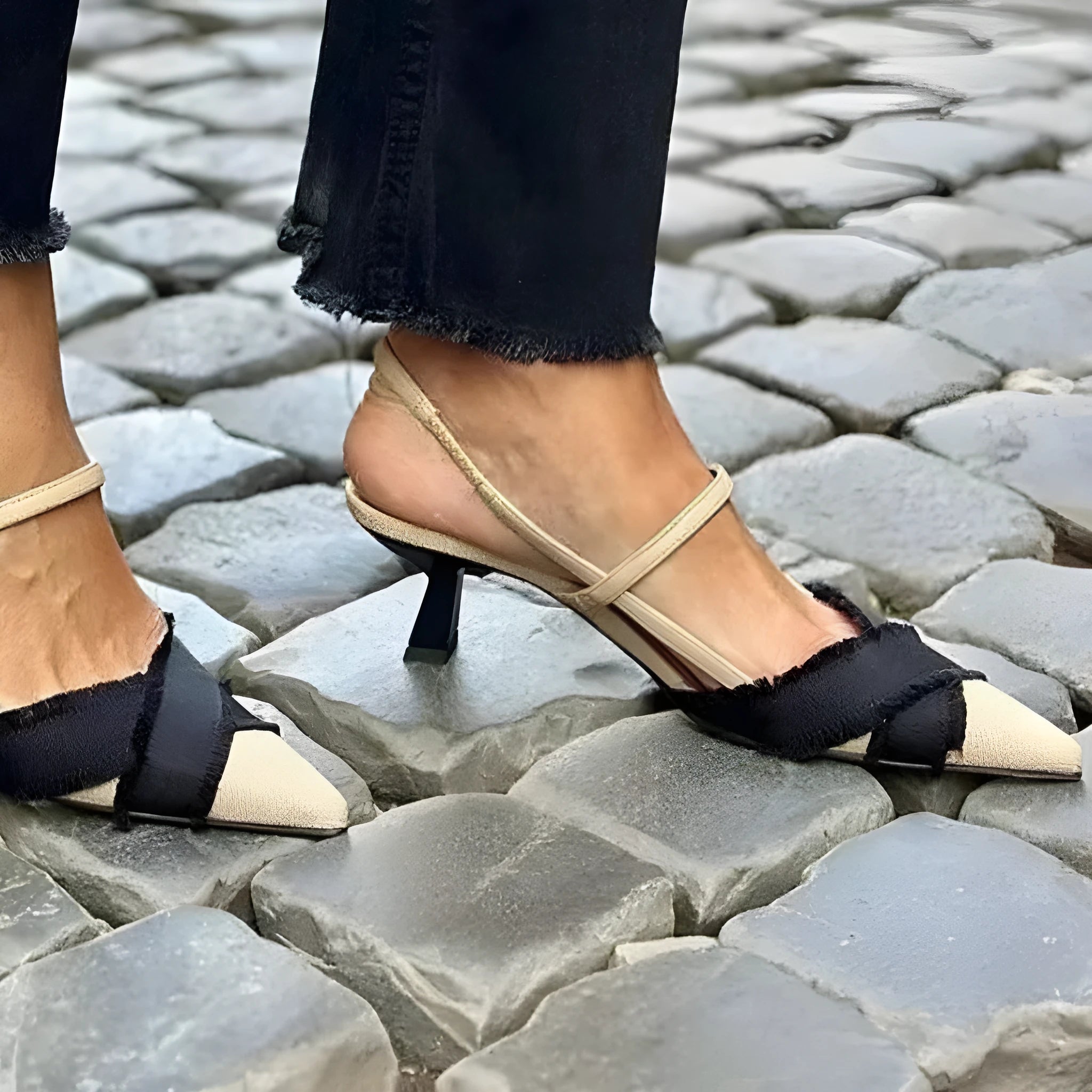 Women's apricot and black colour-block stiletto heel sandals with pointed toe and buckle fastening.