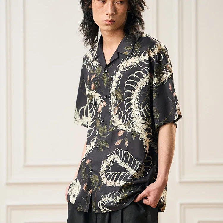 Short sleeve loose fit Cuban collar shirt with a printed snake bone pattern design in a colour option.