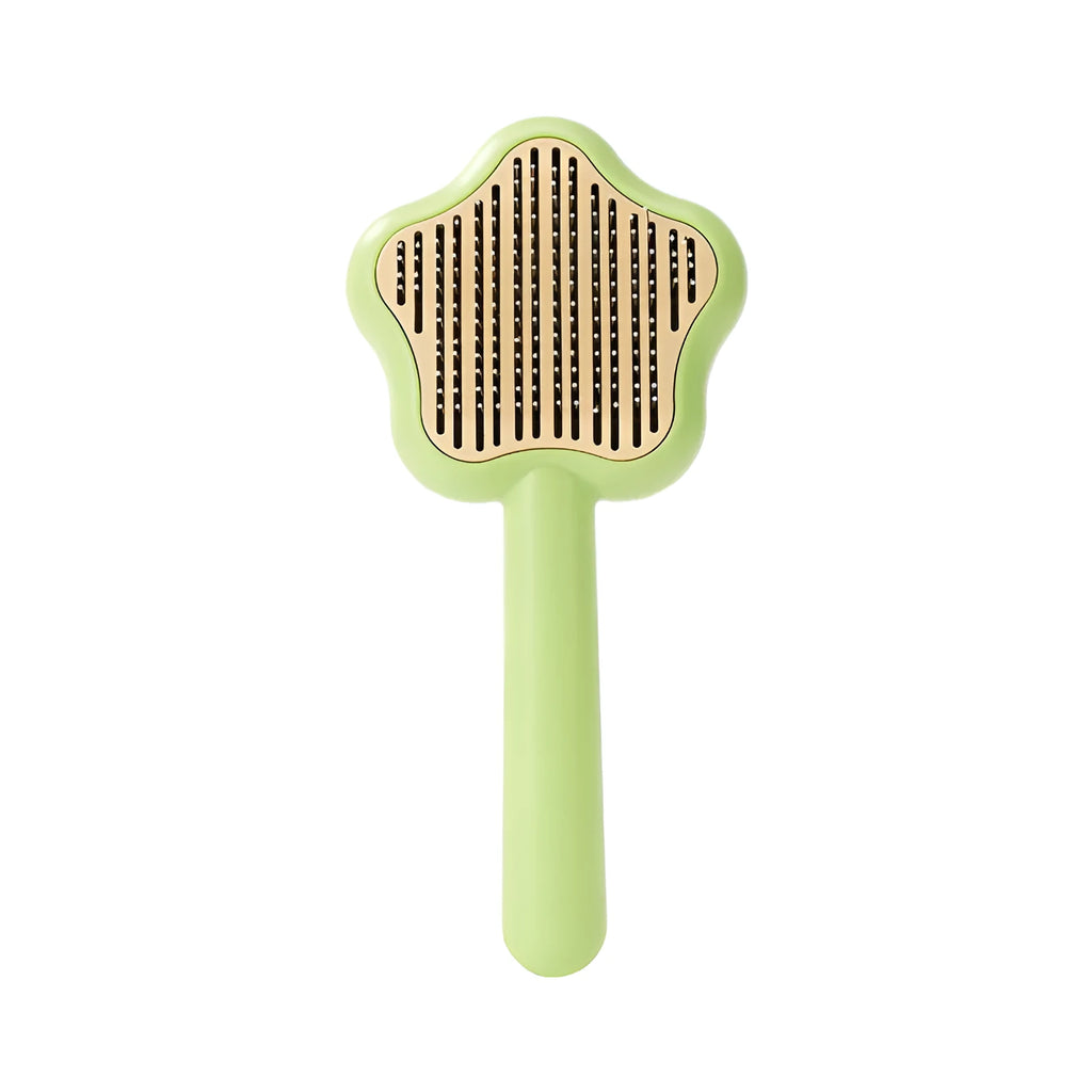 Self-cleaning stainless steel pet comb with green handle, showing the 20cm length and needle teeth