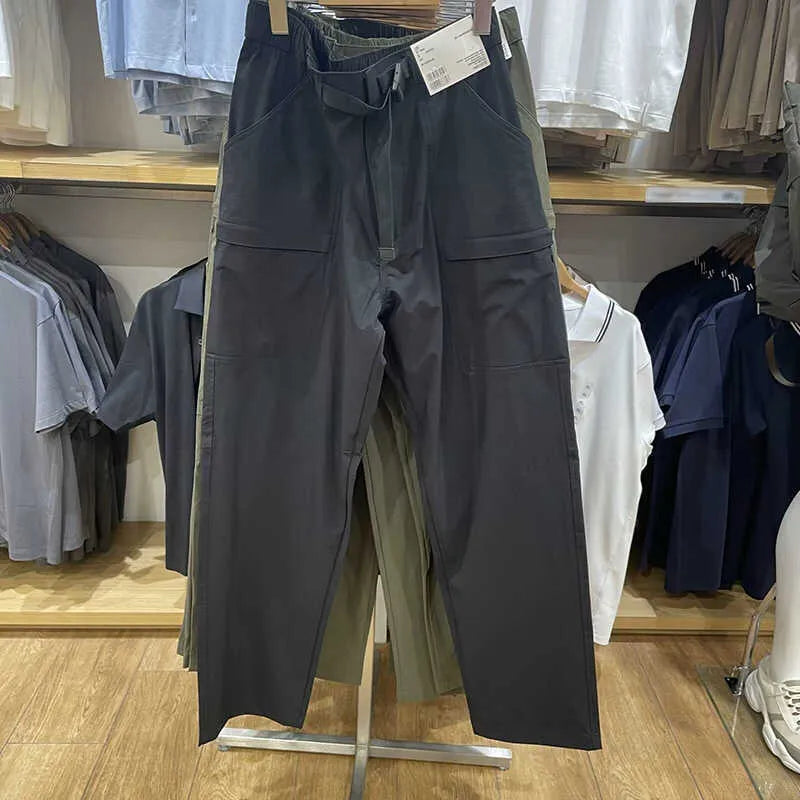 Men's beige straight-leg casual trousers with a mid-waist, made from bamboo fibre fabric.