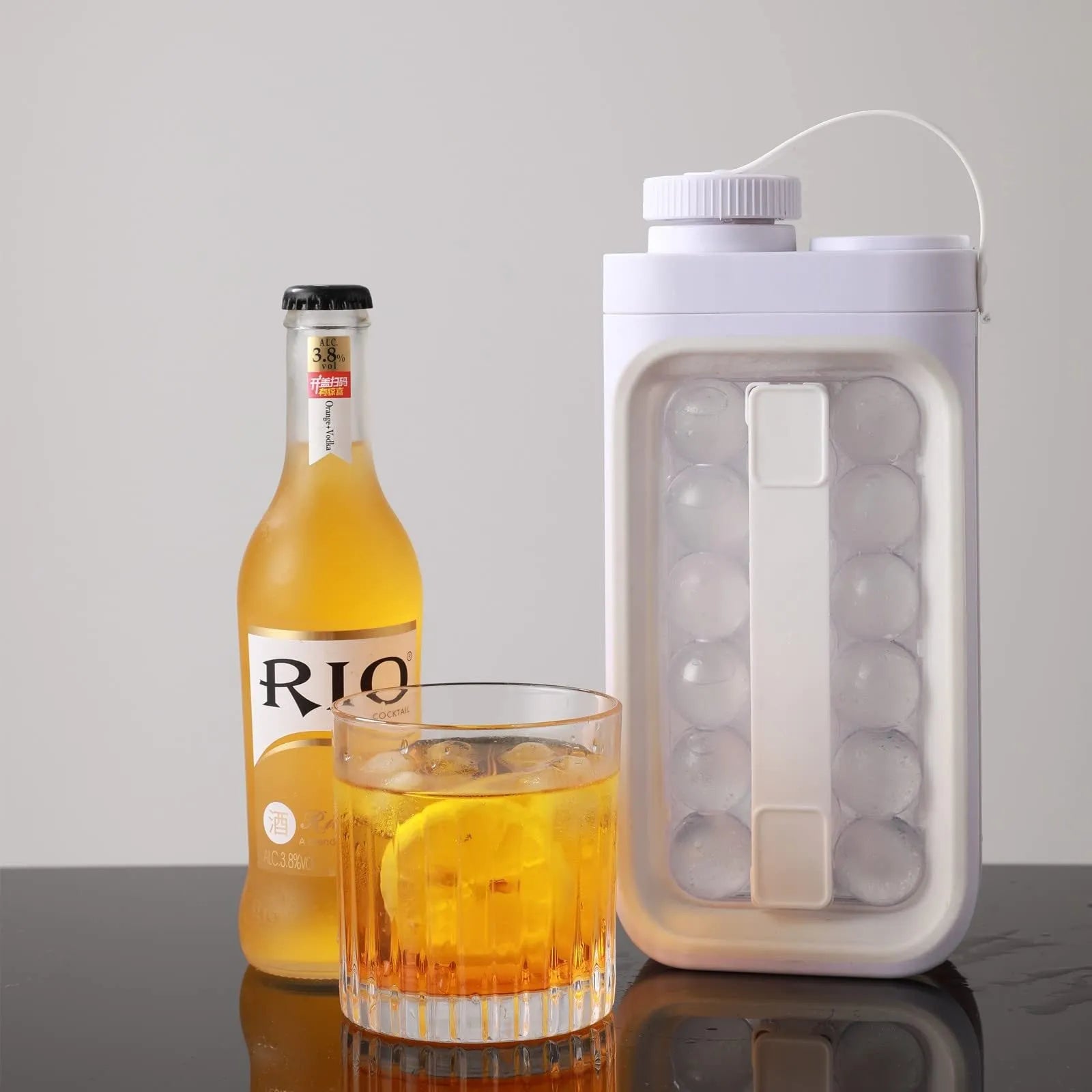 Light blue and white 2-in-1 ice ball maker and cold drink kettle showing 17 ball capacity