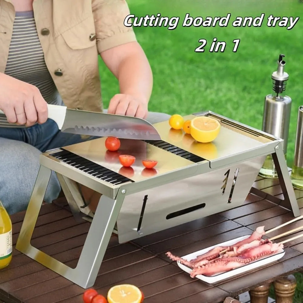 A small, foldable portable charcoal grill for outdoor cooking.