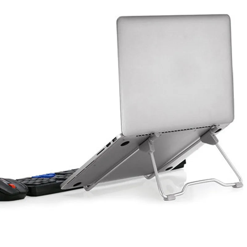 Grey aluminium alloy adjustable phone and laptop stand on desk