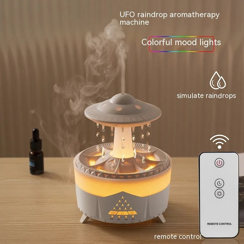 White UFO-shaped humidifier with water droplets creating mist and rain sounds