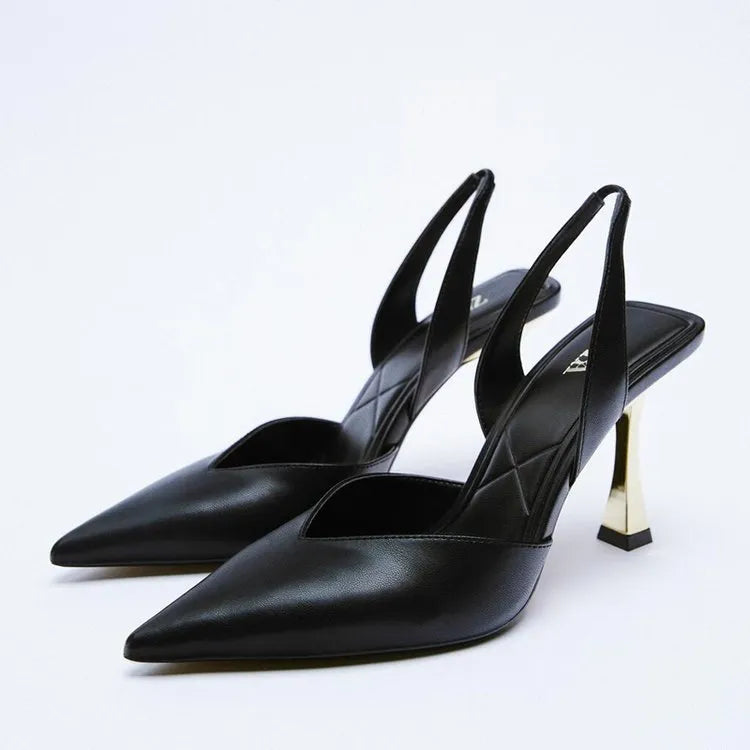 Women's pointed patent leather high heels in apricot colour on a white background.