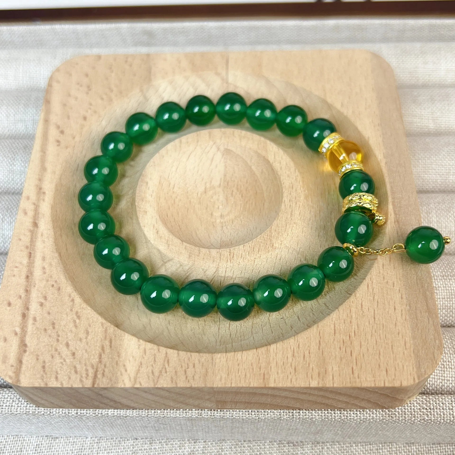 Handmade green chalcedony and red agate beaded bracelet with copper geometric design