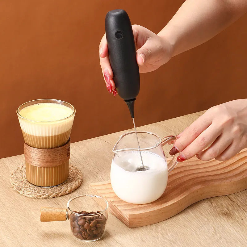 Hand-held electric milk frother blender in black colour with modern simplicity design
