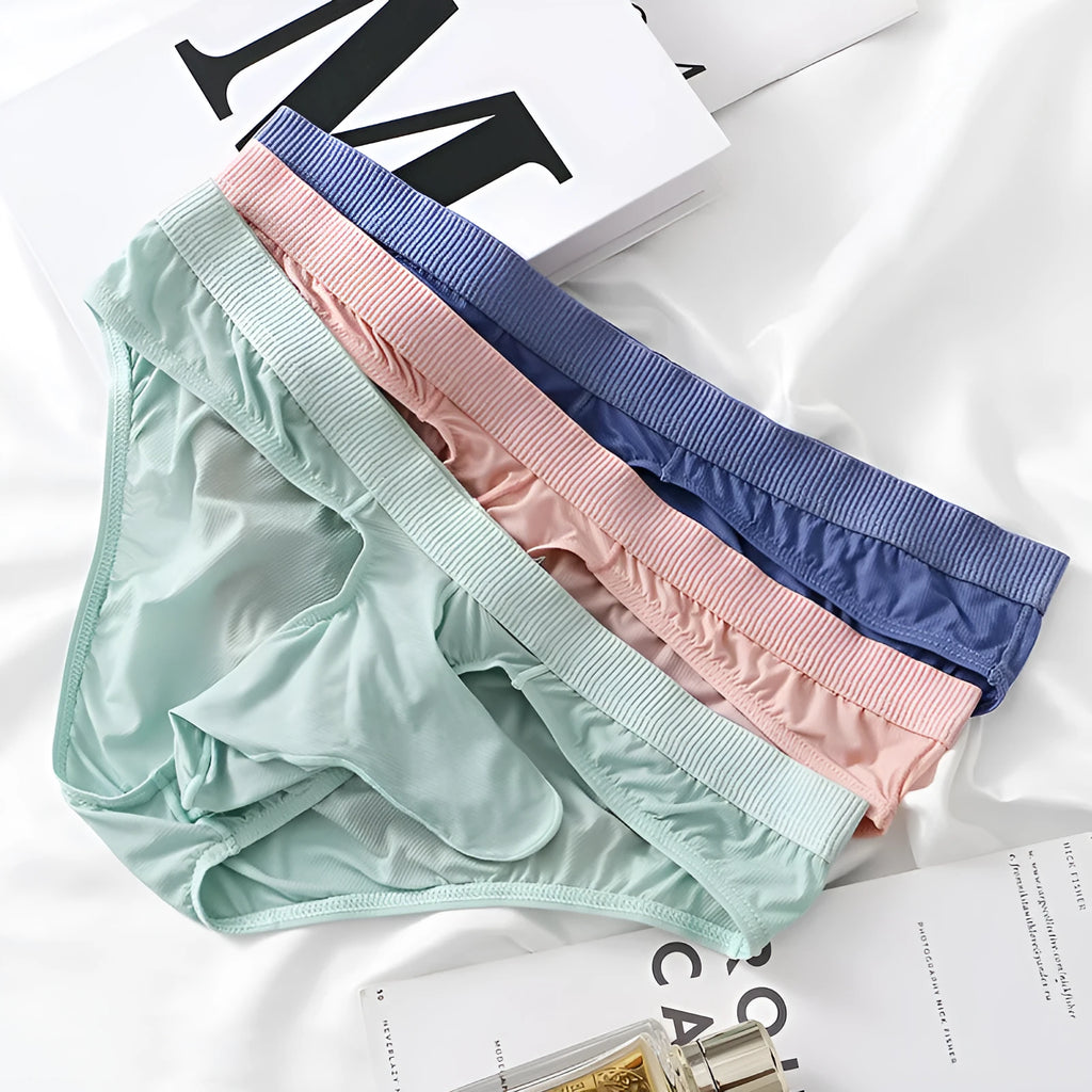 Men's low waist briefs in Ice Silk fabric showing available colours: black, grey, light green, pink, purplish blue.