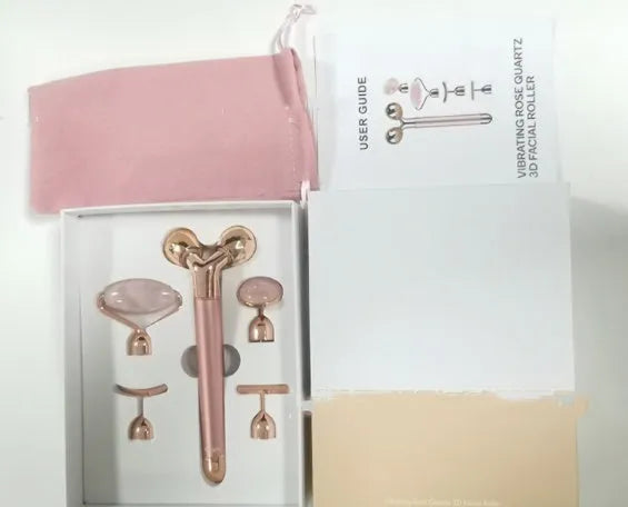 Rose gold five-in-one vibrating face massager with jade roller, disc, U-shaped and T-shaped beauty heads in colour box