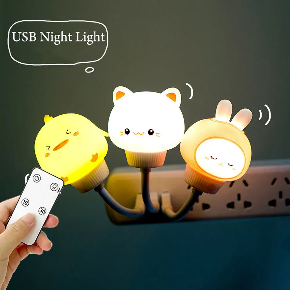 Cute cartoon animal USB night light in bear shape with soft white glow on a bedside table.