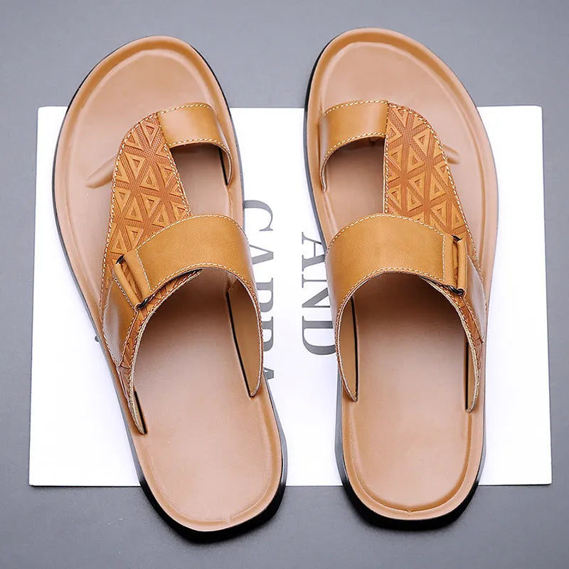 Men's light brown open-toe beach slippers made from cowhide leather with a rubber sole.