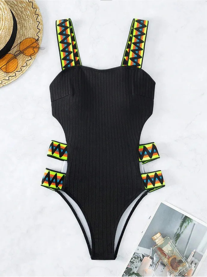 Women's black one-piece polyester swimsuit on a hanger, Asian sizing.