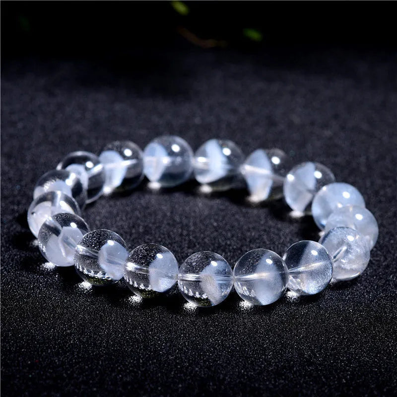Women's white crystal ghost bracelet with a ruyi element, showing adjustable bead sizes.
