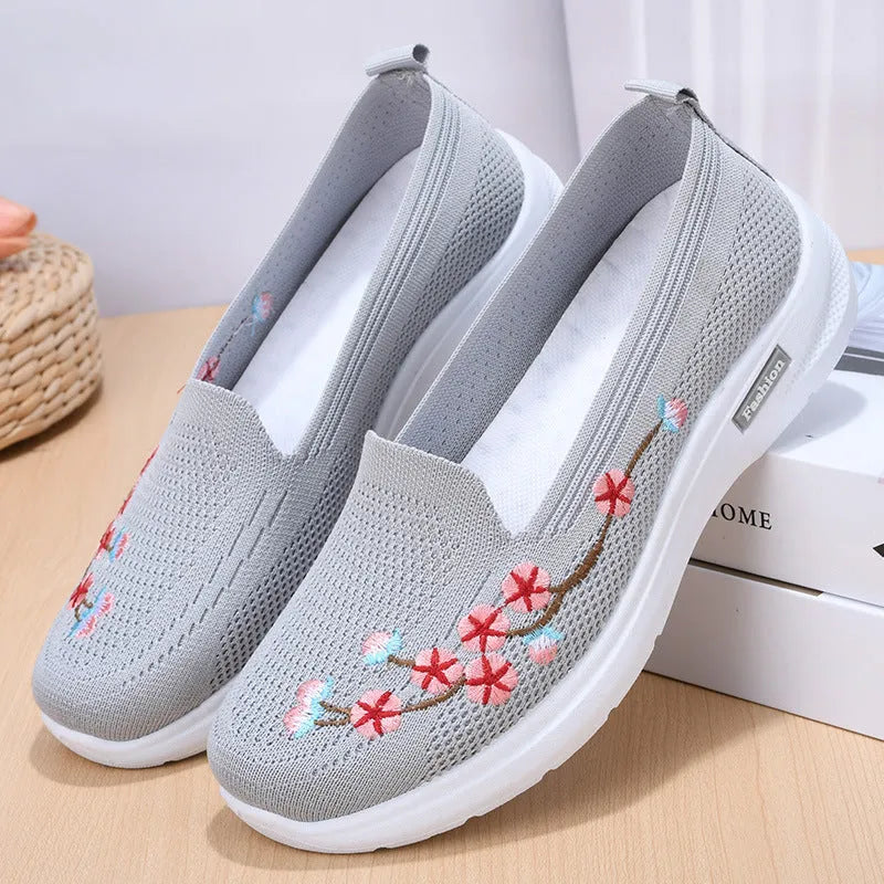 Women's wine red embroidered floral woven pumps with a flat anti-slip sole.