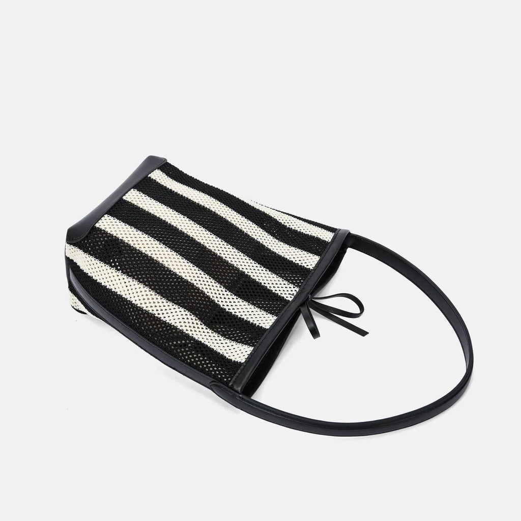 Black and white striped woven fabric women's bucket shoulder bag.
