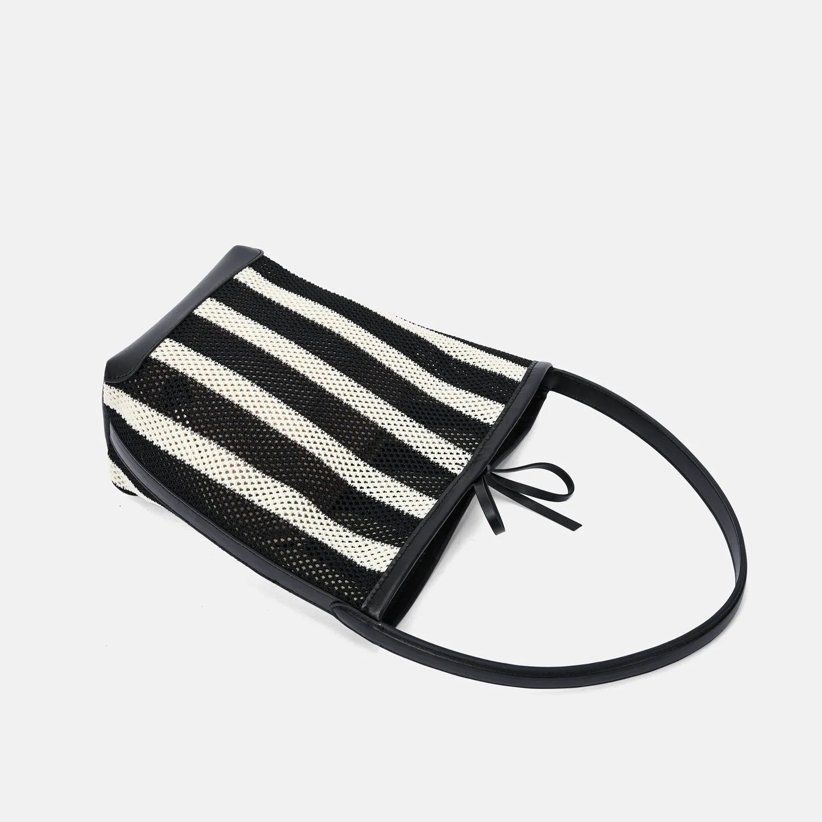Black and white striped woven fabric women's bucket shoulder bag.