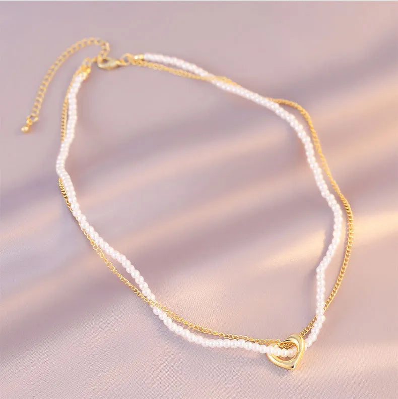 Female vintage retro imitation pearl necklace with geometric shape, adjustable 21-50cm perimeter, available in multiple colours