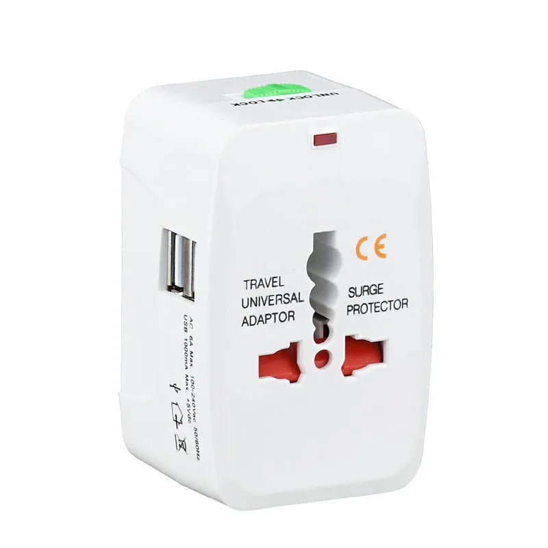 White universal travel plug adapter with dual USB ports and interchangeable UK EU US AU plugs on a plain background